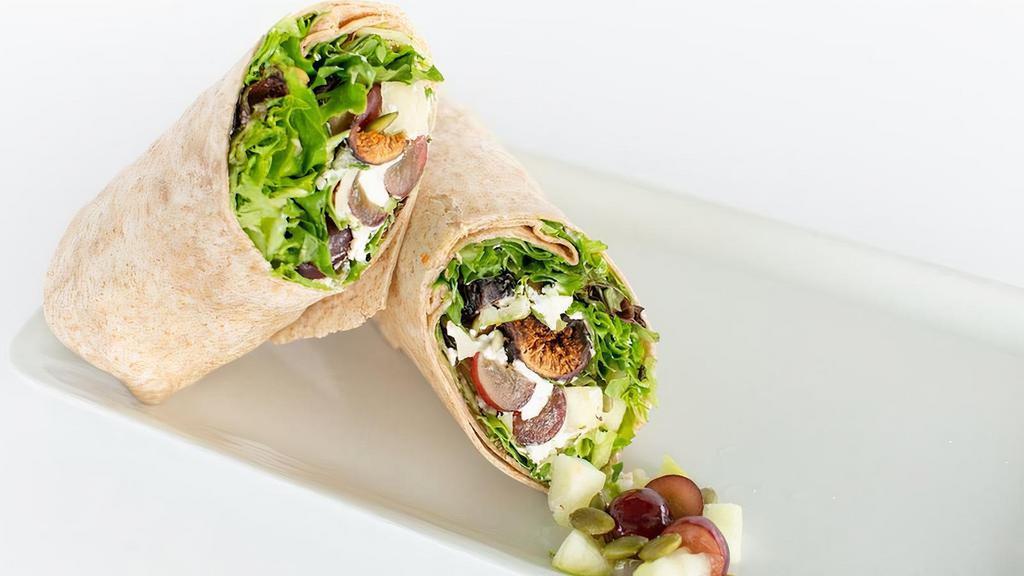 Harvest Wrap · Spring mix and baby arugula, apples, seasonal fruit, dried figs, pumpkin seeds, goat cheese, with balsamic vinaigrette. Vegetarian.