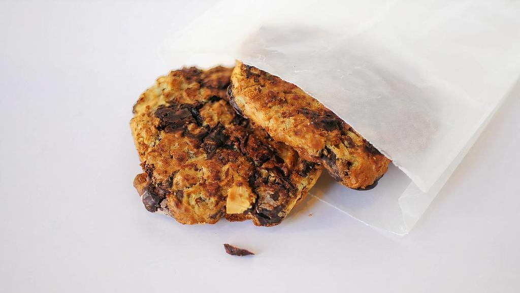 Banana Chocolate Chip Cookie · Whole wheat flour, sugar, vanilla, applesauce, coconut milk, eggs, toasted coconut flakes, toasted sliced almonds, banana, Ghirardelli chocolate chips, and oatmeal.