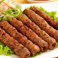 #14. Shish Kabab (St) · Minced lamb mixed with fresh spices and herbs cooked on skewers in a tandoor oven.