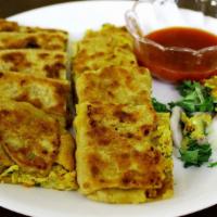 #12. Egg Mughlai · Multi layers of flour stuffed with eggs and fresh herbs.
