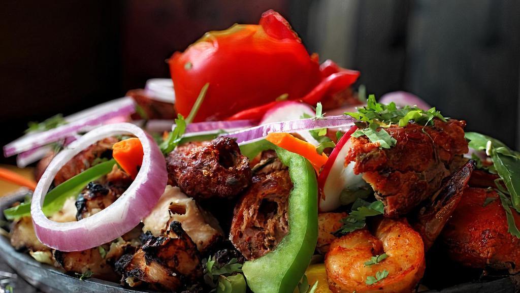 #24. Reshmi Mixed Grill Platter · Tandoori chicken, chicken tikka, chicken kabab, shrimp tandoori, sheek kabab.