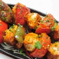 #19. Chicken Shashlik · Tender pieces of chicken marinated in chef’s special spices and barbecued in the tandoor wit...