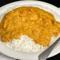 #45. Korma · Cooked in thick mild creamy sauce and nuts.