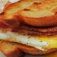 Breakfast Sandwich · Egg, seasonal veggies, potatoes, and choice of sausage, ham, or bacon.