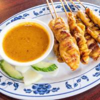 Satay Chicken Or Beef · Spicy. Marinated chicken or beef skewer, charcoal-grilled to perfection, served with peanut ...