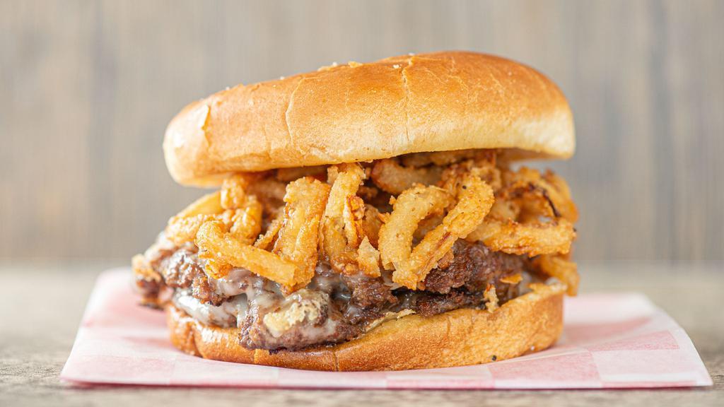 Mushroom Swiss Burger · Fresh mushrooms, onion tangles, and Swiss cheese. Topped with A1.