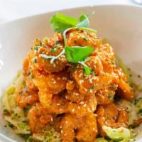 Dynamite Shrimp · Shrimp tossed in Sweet Chile and Sriracha Sauce.  Atop a Vegetable Mix
