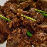 Goat Pepper Fry · GLUTEN FREE. Tender goat meat fried and spiced with crushed pepper.