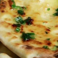 Butter Naan · Traditional bread made with leavened dough flavored with butter.