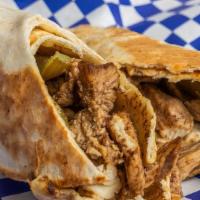 Chicken Shawarma · Grilled marinated chicken, pickle, garlic sauce or ranch wrapped in pita bread.