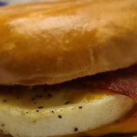 Bagel Sandwich · Two eggs, your choice of bacon strips, sausage or ham on a toasted bagel.