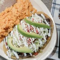 Huaraches · Bread, beans, lettuce, tomatoes, cheese, sour cream, avocado, and choice of meat.