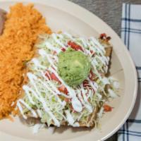 Flauta Plate · Three flute shaped tacos filled with chicken and cheese, topped with lettuce, sour cream, an...