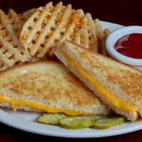 Kids Grilled Cheese · Sliced white bread grilled golden brown with American cheese.  Served with choice of waffle ...