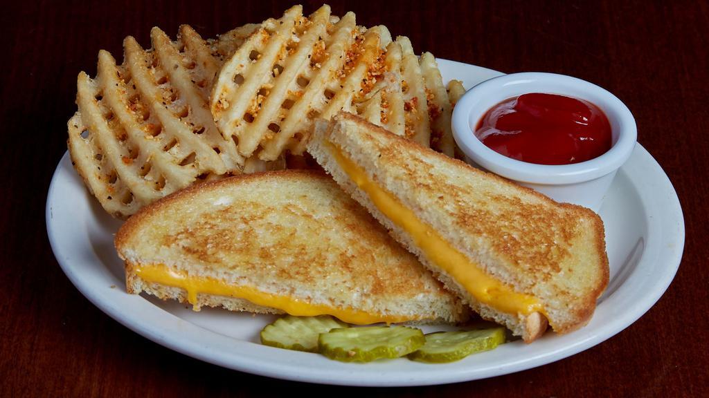 Kids Grilled Cheese · Sliced white bread grilled golden brown with American cheese.  Served with choice of waffle fries, chips, fresh apple slices or coleslaw.