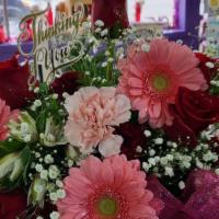 Birthday Basket Of Joy · Basket filled with a colorful array of beautiful flowers.  Roses, Peruvian lilies, mini carn...