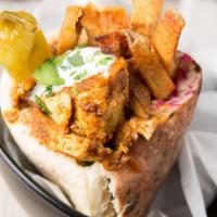 Shredded Beef Buzz Wrap · Wrapped in laffa flatbread with hummus, tomato, jerusalem salad, lettuce, pickles, and tahin...