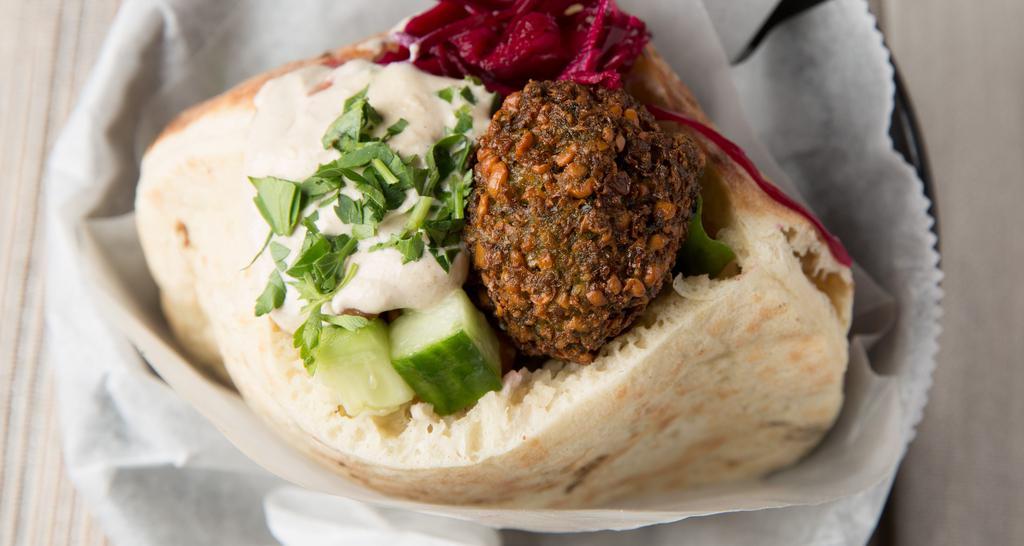 Falafel Sandwich · A mixture of chick peas, parsley, and vegetables deep fried.