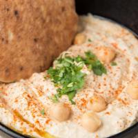 Hummus Hound · A smooth blend of ground chickpeas, tahini sauce, lemon and a hint of garlic topped with oli...