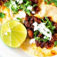 Taco De Chorizo ( Mexican Pork Sausage ) · One Taco With Chopped Cilantro & Onion & Your choice Of Our Delicious Green Or Red Sauce.