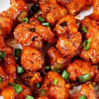 Gobi 65 · Marinated cauliflower sautéed in house special slightly tangy 65 sauce and fried to perfecti...