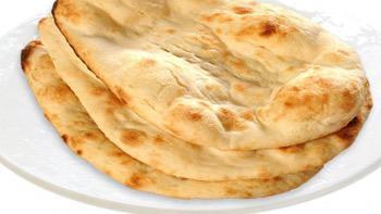 Plain Naan · Traditional Indian bread baked in clay oven.