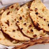 Tandoori Roti · Whole wheat Indian bread baked in the tandoor.