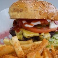 Bacon Cheeseburger · Lettuce, tomatoes, turkey bacon, pickles, cheese, mayo and ketchup on a sesame bun.