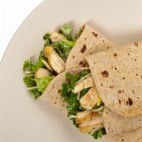 The Chicken Caesar Wrap · Delicious wrap made with seasoned chicken, crispy romaine lettuce, sliced tomatoes, onions, ...