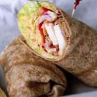 The Turkey And Bacon Wrap · Delicious wrap made with slices of turkey, crispy bacon, romaine lettuce, sliced tomatoes, o...
