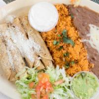 Chicken Flautas · Get 4 Flautas that comes with Guacamole and Sour cream and Served with Rice and Beans