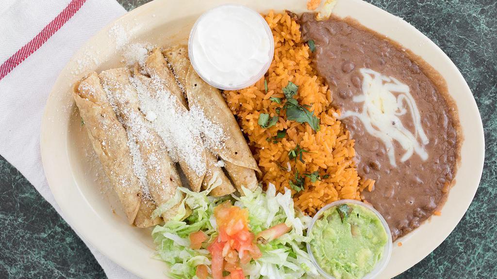 Chicken Flautas · Get 4 Flautas that comes with Guacamole and Sour cream and Served with Rice and Beans