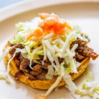 Chile Relleno Sope · Includes rice, beans, cheese, lettuce, and tomato.