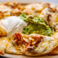 Nachos With Meat · Includes: Lettuce, Tomatoes, Cheese, SourCream, Guacamole, Jalapenos, Beans