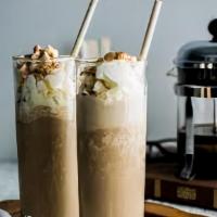 Vanilla Bean Frappe · Iced beverage blended to produce a tasty, foamy, and refreshing drink. Served cold with whip...