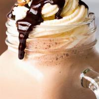 Mocha Coconut Frappe · Iced beverage blended to produce a tasty, foamy, and refreshing drink. Served cold, with whi...