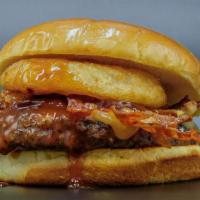 Western Burger · HALF A POUND OF ALL 100% BEEF TOPPED WITH OUR HOMEMADE BBQ SAUCE, SWISS, BACON AND ONION RINGS