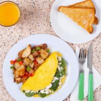 Greek Omelette · Three egg omelette with spinach, feta, tomato, and melted cheddar, served with buttered toas...