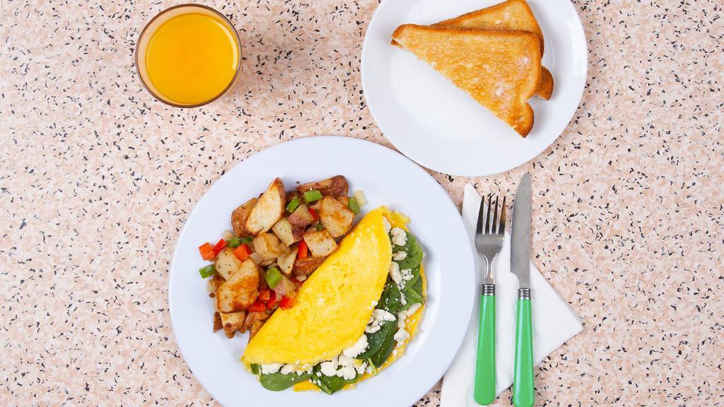 Greek Omelette · Three egg omelette with spinach, feta, tomato, and melted cheddar, served with buttered toast and your choice of breakfast potatoes.
