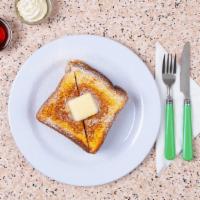 French Toast · Four thick slices of egg-washed cinnamon toast with maple syrup.