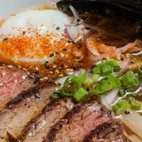 Shoyu Prime · seaweed dashi broth, poached egg, bamboo, green and red onion, filet mignon (med rare beef)