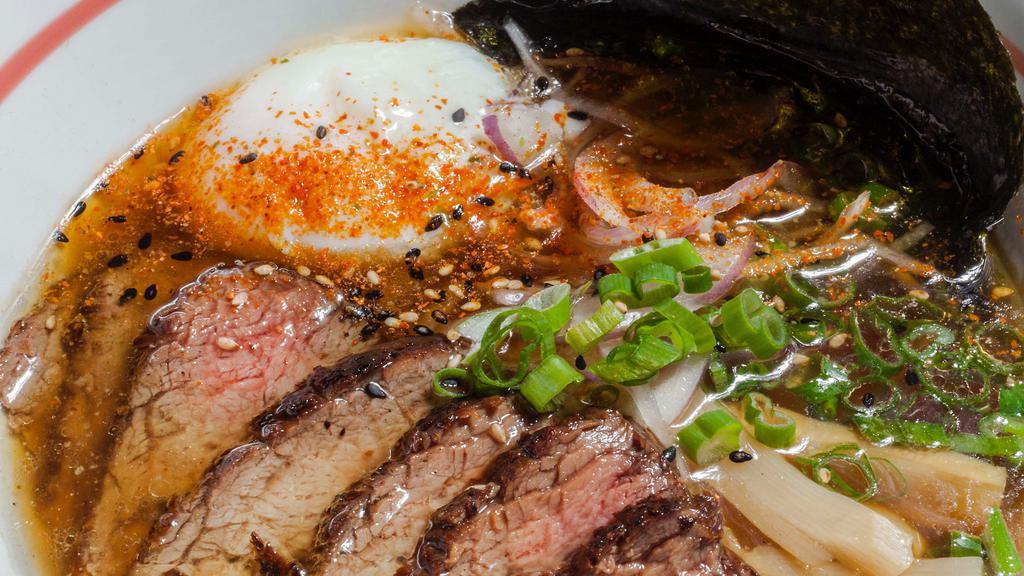 Shoyu Prime · seaweed dashi broth, poached egg, bamboo, green and red onion, filet mignon (med rare beef)