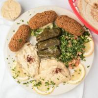 Vegetarian Combination Plate · Combination of three falafel, three stuffed grape leaves, hummus, baba ghannoug, and taboule...