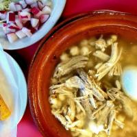 Pozole Estilo Morelos · Servido con dos tacos dorados, un huevo hervido, aguacate, rabanos, repollo y cebolla picada...