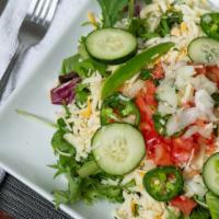 Veggie Taco Salad · Refried beans, rice, sour cream, lettuce, cheese tomatoes, jalapenos and Mozzarella cheese.