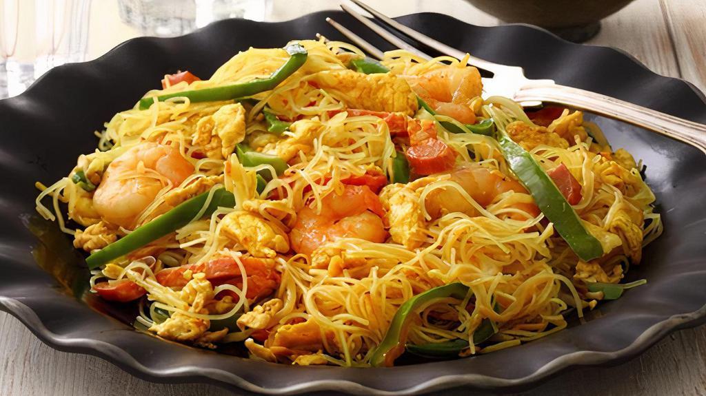 Singapore Rice Noodles ( Spicy )  ( Large ) · Str-Fry Rice Noodles with shrimp and pork in spicy curry sauce.