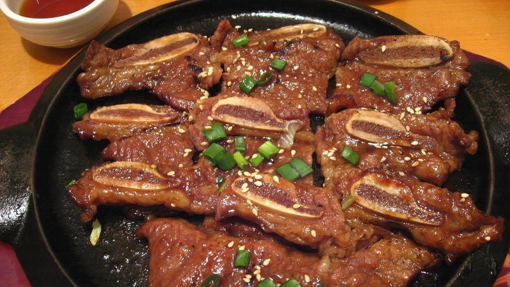 Kalbi Short Ribs ( Large )  · Juicy beef short ribs marinated in Korean style bbq sauce and grill to perfection.
