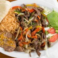 Grilled Steak Fajitas  · Combination of green peppers, red peppers, onions, cilantro, and steak meat.