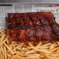Half Slab Dinner · 6 bones of bbq baby back ribs with your choice of potatoes, coleslaw