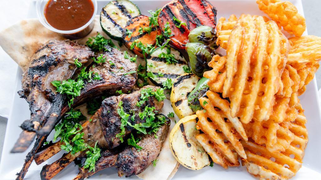 Lamb Chops · Four pieces of french cut lamb chops, marinated and charbroiled, served with grilled vegetables.